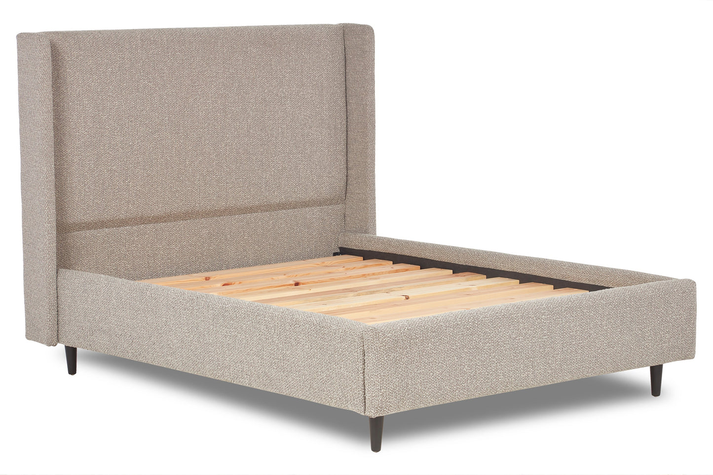 Nina Upholstered bed with winged headboard and legs